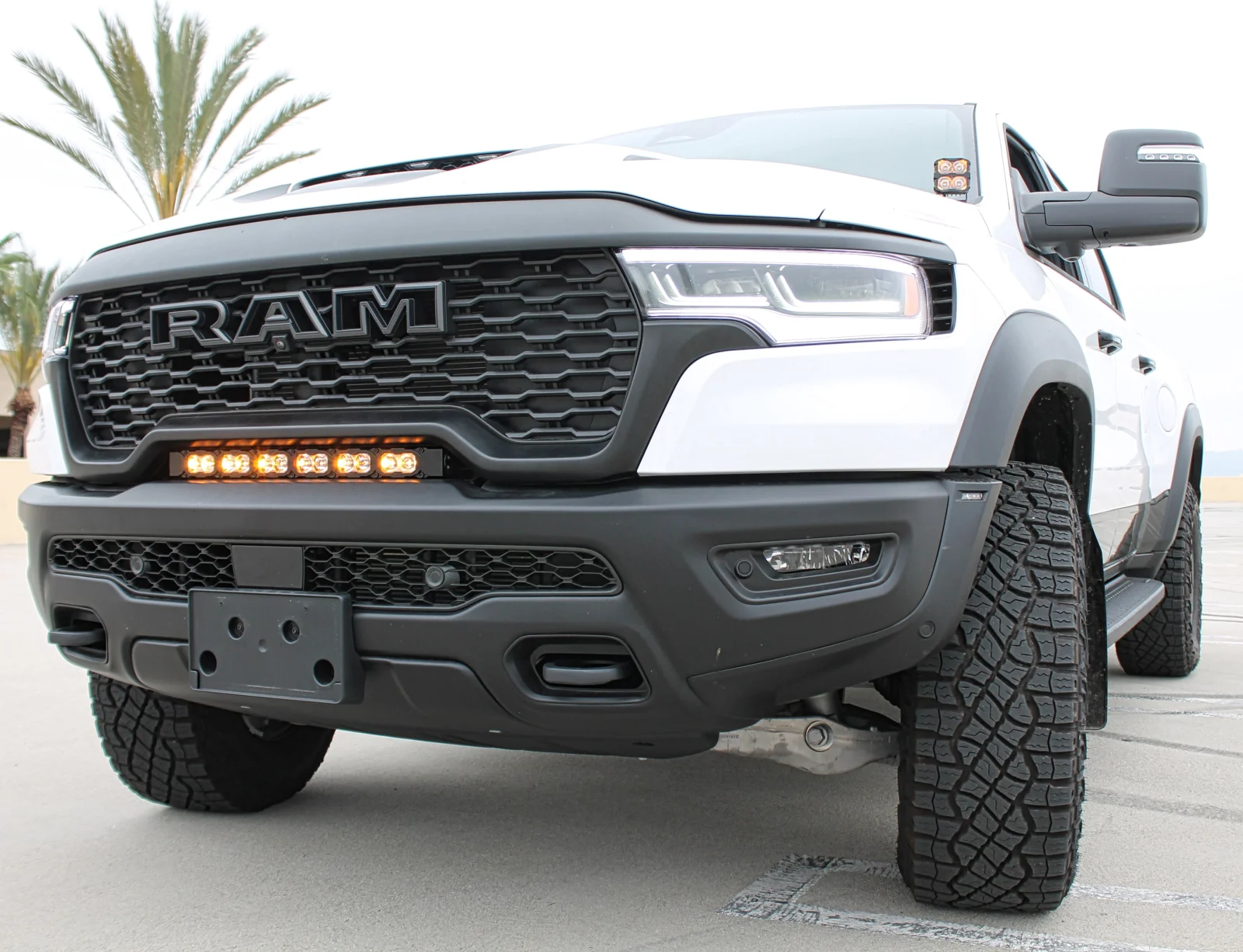 RAM-RHO-light-bar-2025-2026-1500-rebel-curved-led-pro-fit-between-grille-and-bumper-slim-blac...webp